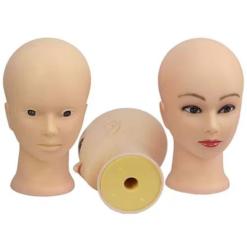 A female bald mannequin head is displayed as a dummy head
